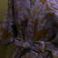 Korte kimonovest met 3/4 mouwen in feestelijke stof. Onmiddellijk beschikbaar.